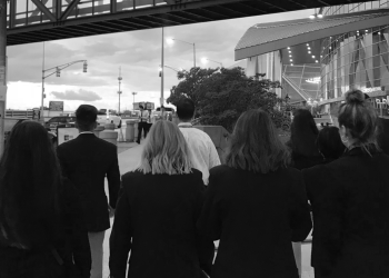 women in suits on a street