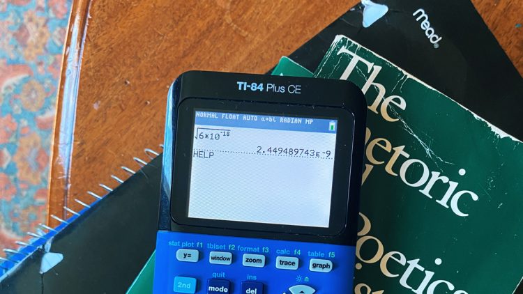 calculator and a book on a table
